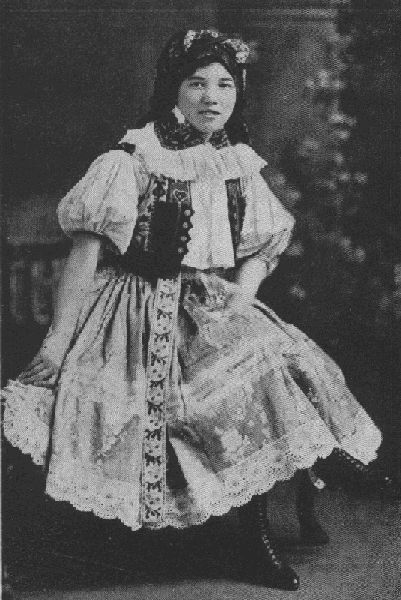IT'S A LONG WAY FROM THIS ELABORATE CZECHO-SLOVAK COSTUME TO THE MODERN AMERICAN STYLES